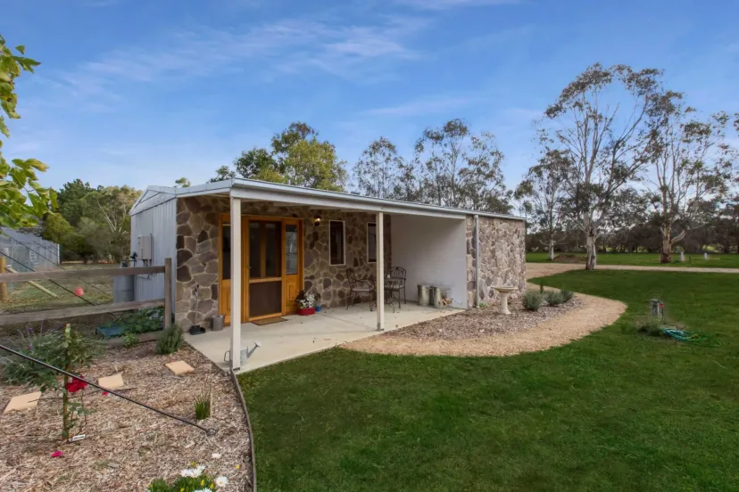 Shearers Cottage, the restored stone shearing shed, with its verandah and garden