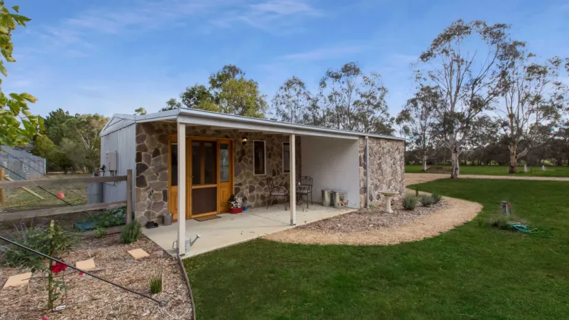 Shearers Cottage, the restored stone shearing shed, with its verandah and garden