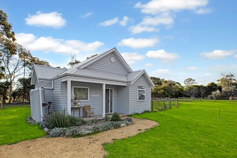 The Gables cottage exterior with its cottage garden and lawn