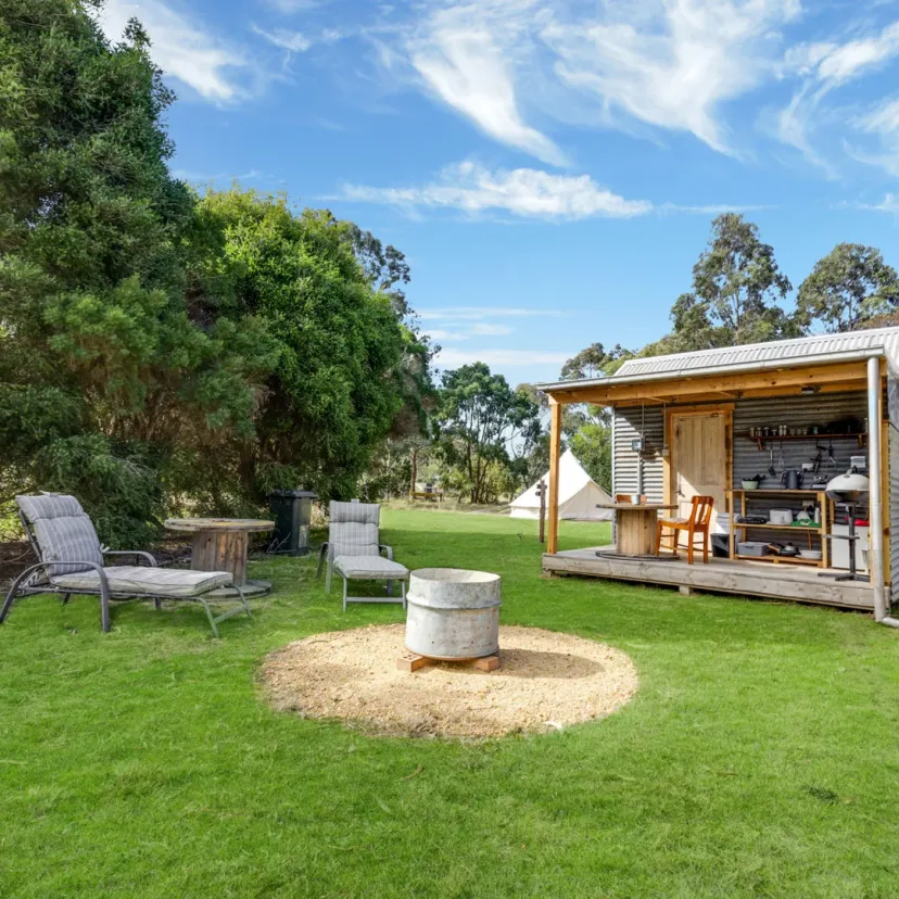 Interior and grounds at the Stargazer glamping tent, Eagle Point Cottages