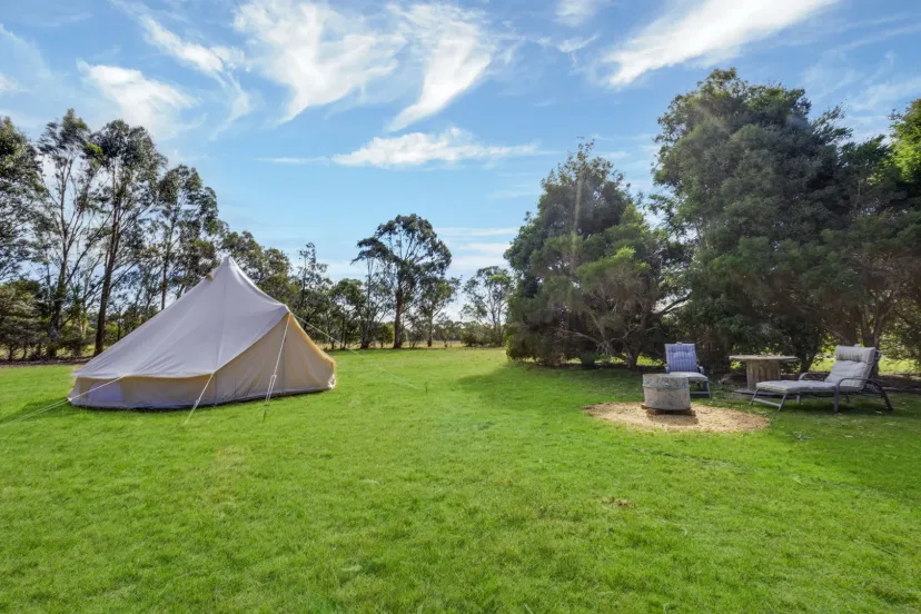 Interior and grounds at the Stargazer glamping tent, Eagle Point Cottages