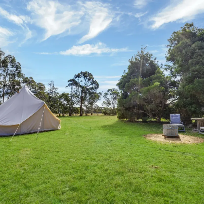 Interior and grounds at the Stargazer glamping tent, Eagle Point Cottages