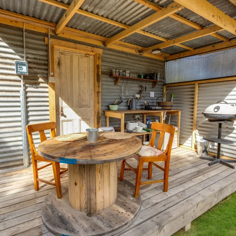 Interior and grounds at the Stargazer glamping tent, Eagle Point Cottages