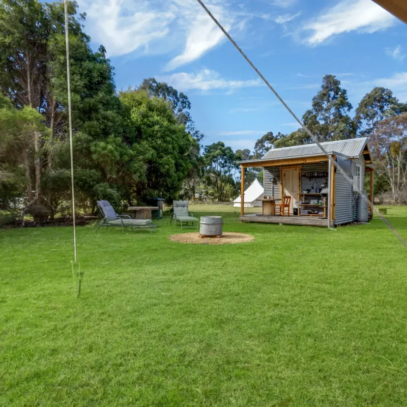 Interior and grounds at the Stargazer glamping tent, Eagle Point Cottages