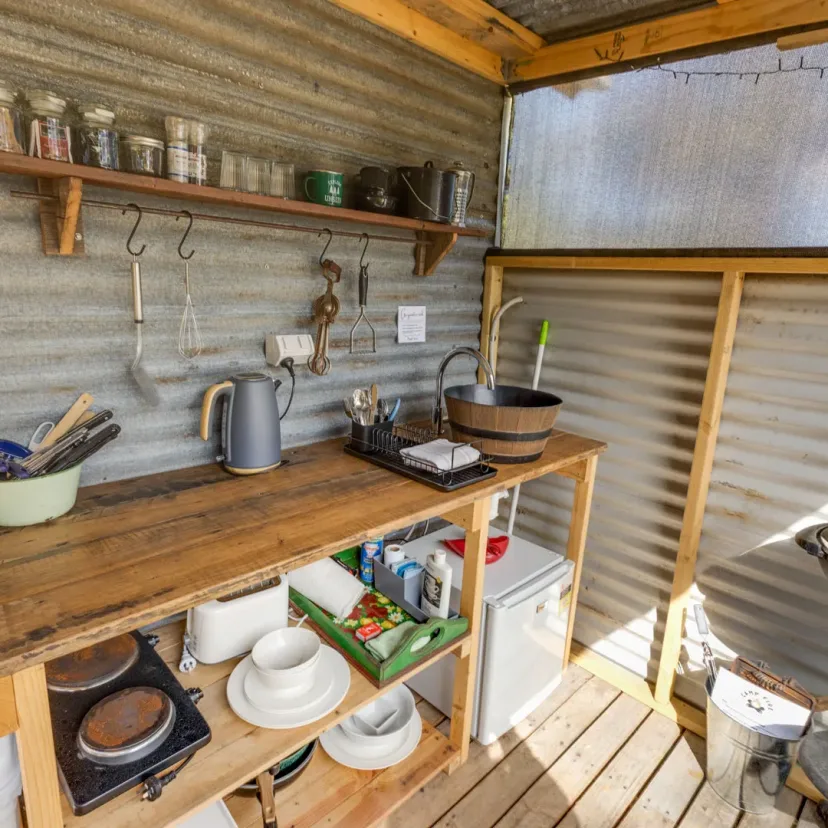 Interior and grounds at the Stargazer glamping tent, Eagle Point Cottages