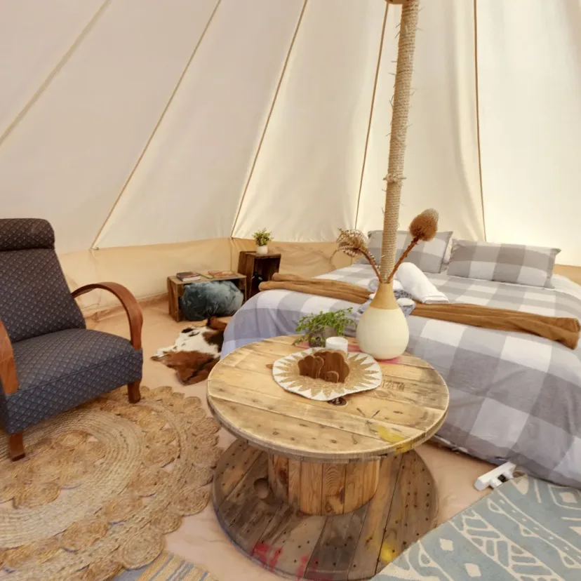 Interior and grounds at the Stargazer glamping tent, Eagle Point Cottages