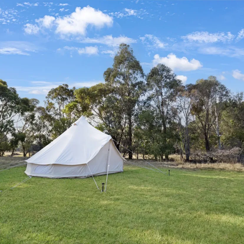 Interior and grounds at the Wanderlust glamping tent, Eagle Point Cottages