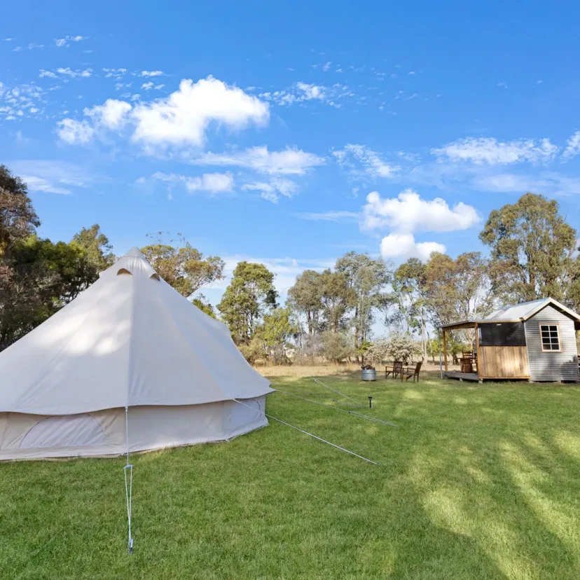 Interior and grounds at the Wanderlust glamping tent, Eagle Point Cottages