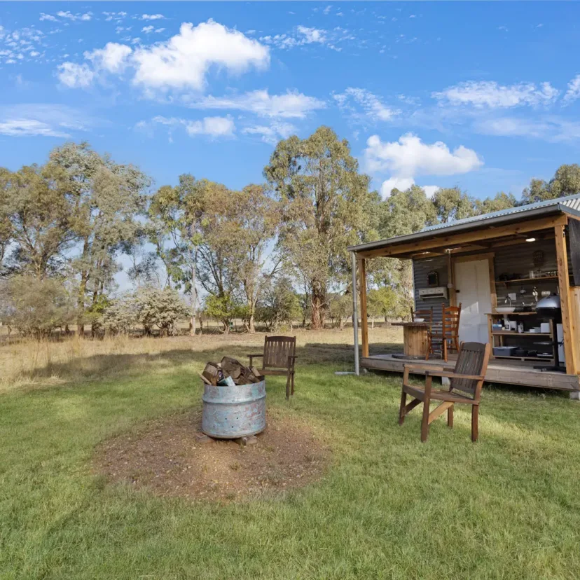 Interior and grounds at the Wanderlust glamping tent, Eagle Point Cottages