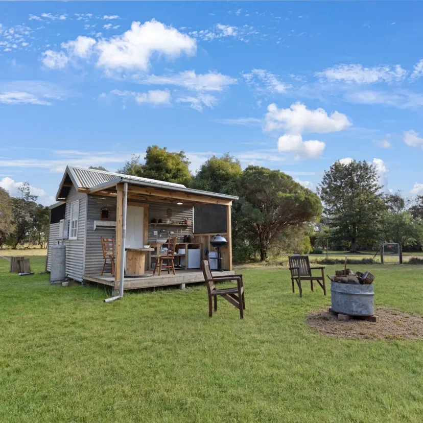 Interior and grounds at the Wanderlust glamping tent, Eagle Point Cottages