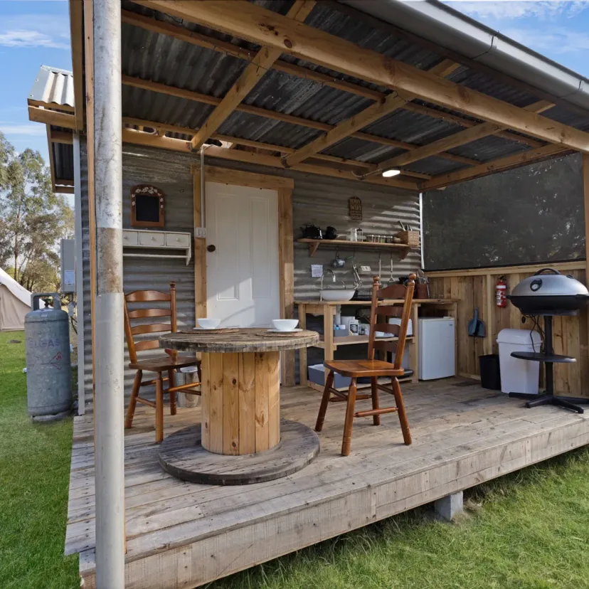 Interior and grounds at the Wanderlust glamping tent, Eagle Point Cottages