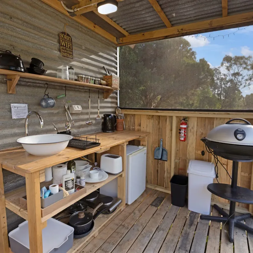 Interior and grounds at the Wanderlust glamping tent, Eagle Point Cottages