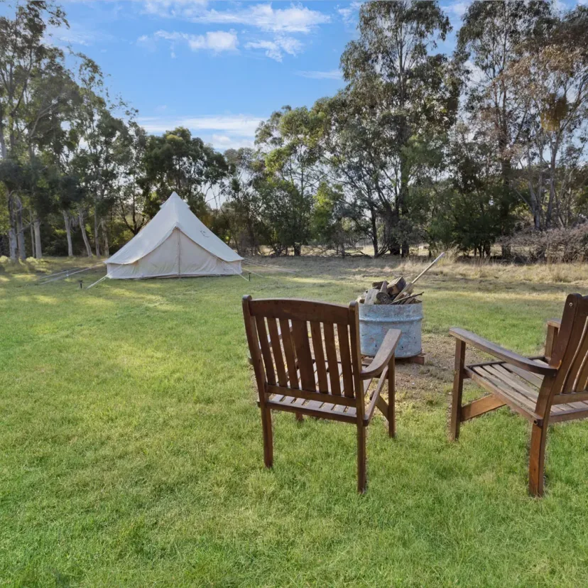 Interior and grounds at the Wanderlust glamping tent, Eagle Point Cottages