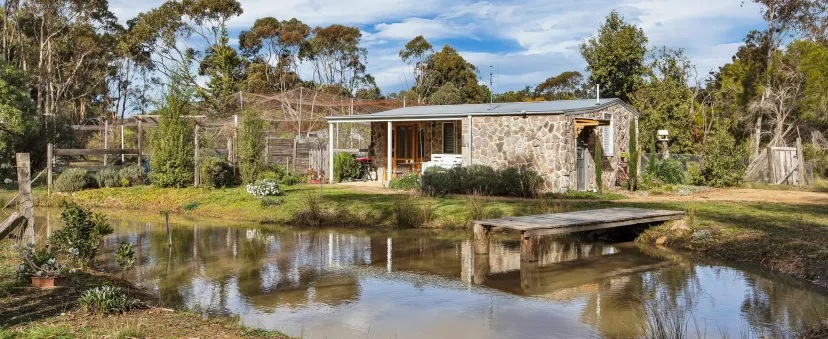 Shearers Cottage reflected in the property dam